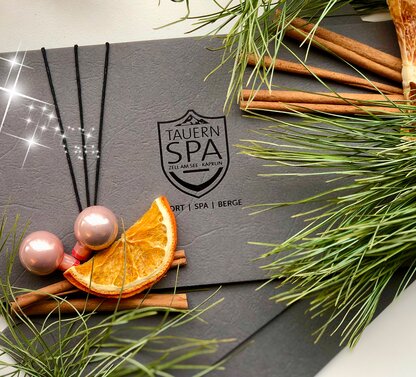 Grey Tauren SPA voucher with cinnamon sticks, orange slice, balls and fir branches