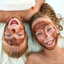 Two laughing children with face masks lying next to each other | © ©Victoria М - stock.adobe.com