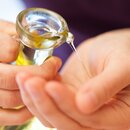 Massage oil is poured into a hand | © Copyright 2012, Alexander Maria Lohmann