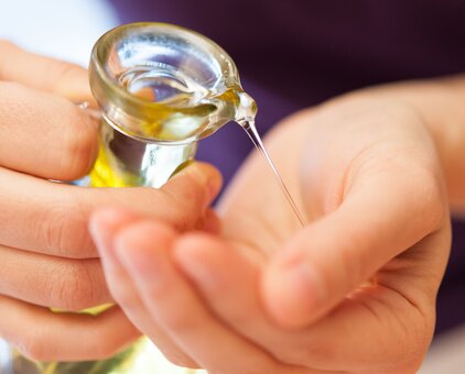 Massage oil is poured into a hand | © Copyright 2012, Alexander Maria Lohmann