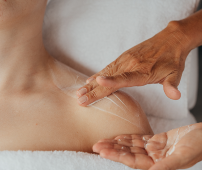 Cream massage on bare shoulder in the spa